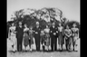 Joseph Kennedy Sr. (fifth from left) and his wife Rose (fifth from right) pose for a family portrait on the grounds of the U.S. embassy in London, where Joe was serving as U.S. ambassador to the U.K.